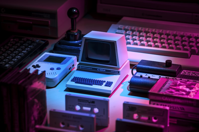 Indie game development workspace with multiple monitors displaying code and graphics